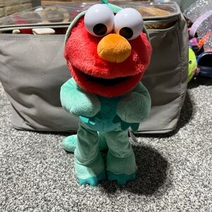 Sesame Street Tickle Me Elmo Dino Dinosaur Stomp Dancing Plush Toy